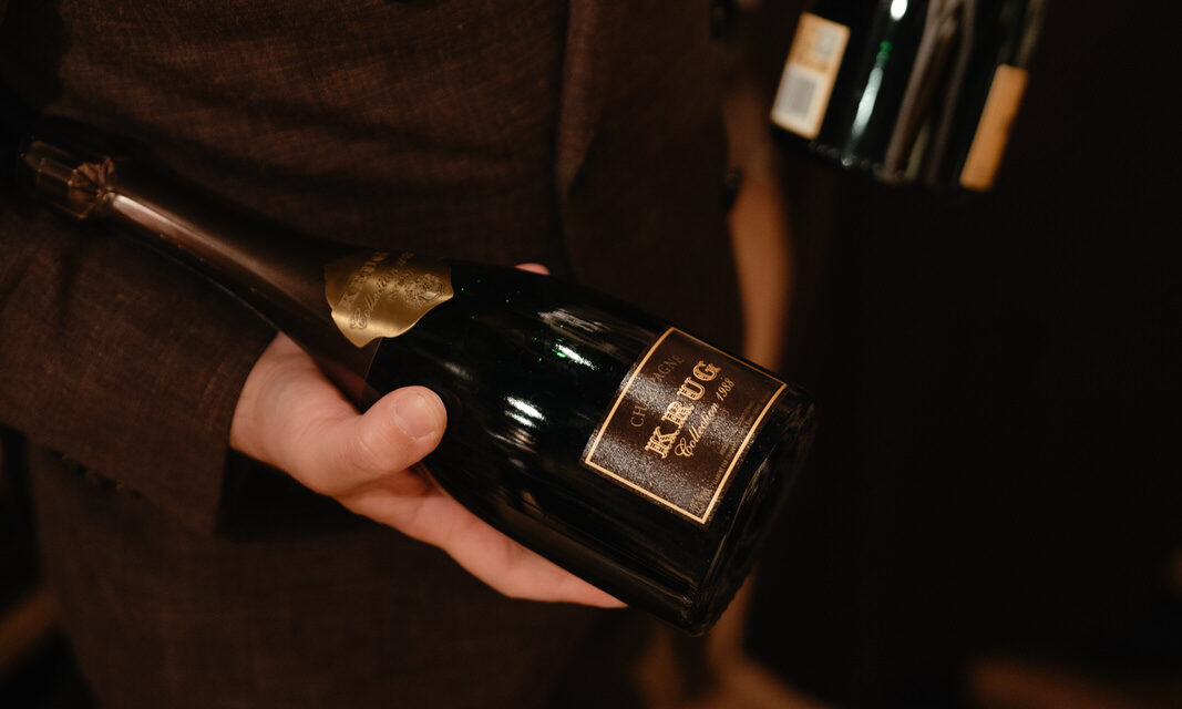 Sommelier holding two bottles of Krug