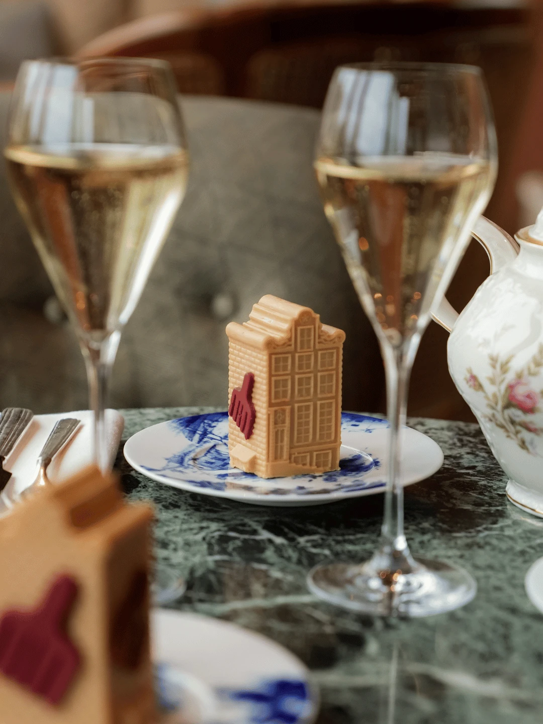Chocolate Canal House with two glasses of champagne